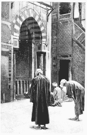 BEFORE THE SACRED NICHE
From a photograph by Sebah, Cairo